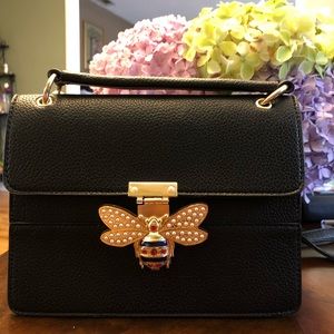 Black faux leather handbag